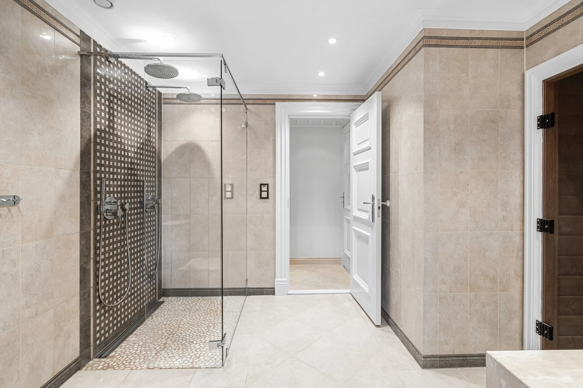 Spa bathroom with walk-in shower and mosaic tile details