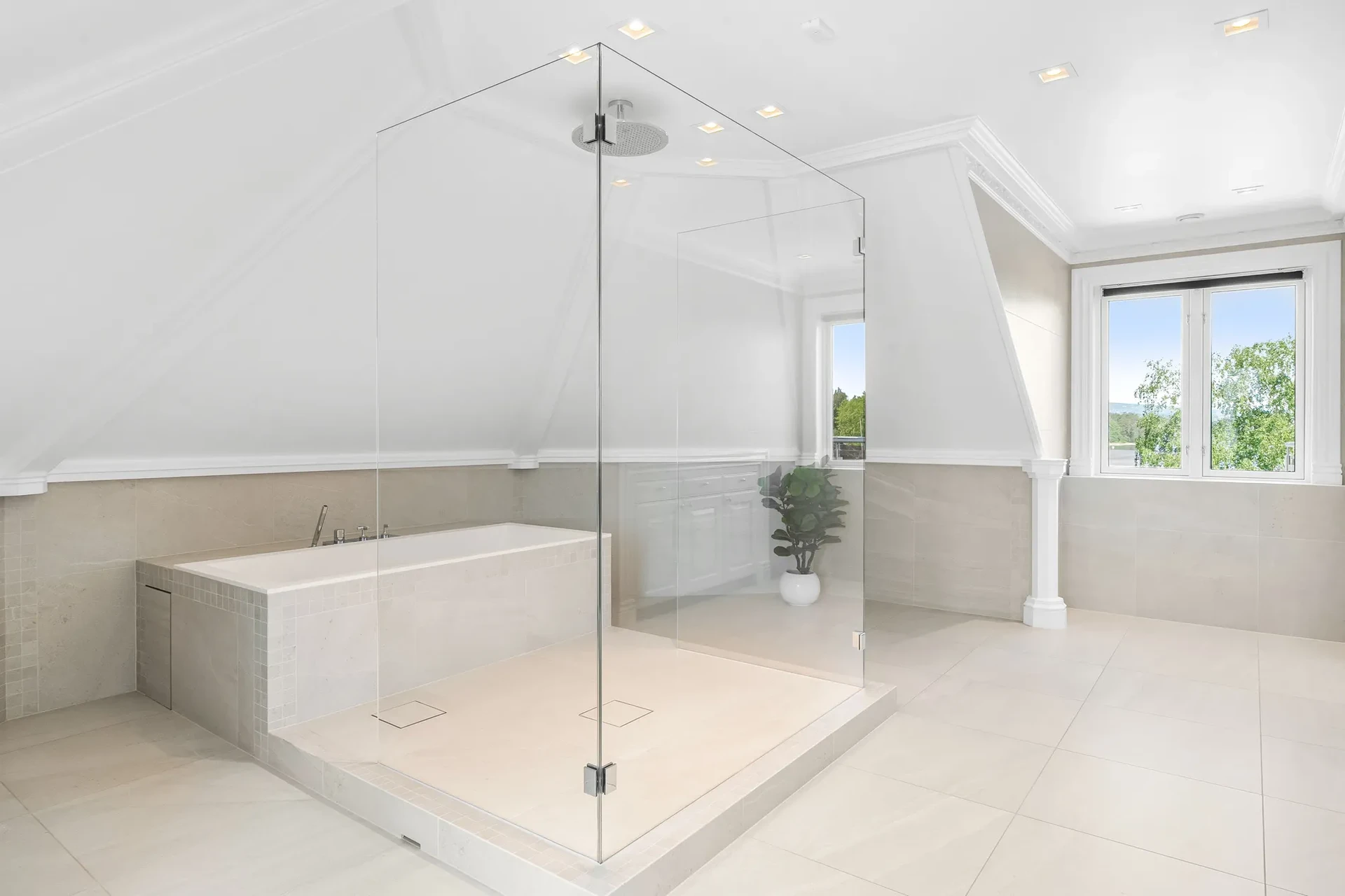 Master bathroom with large glass shower and soaking tub