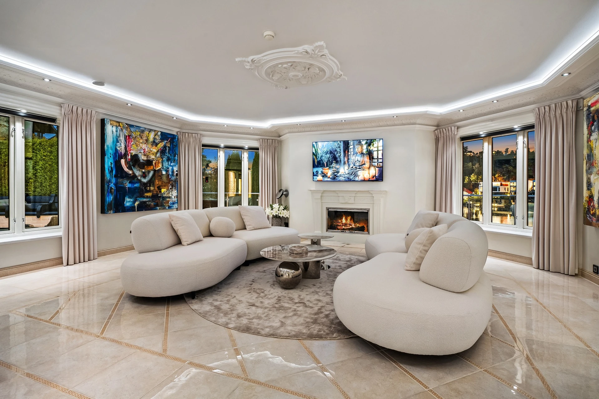 Modern living room with curved sofas and contemporary art