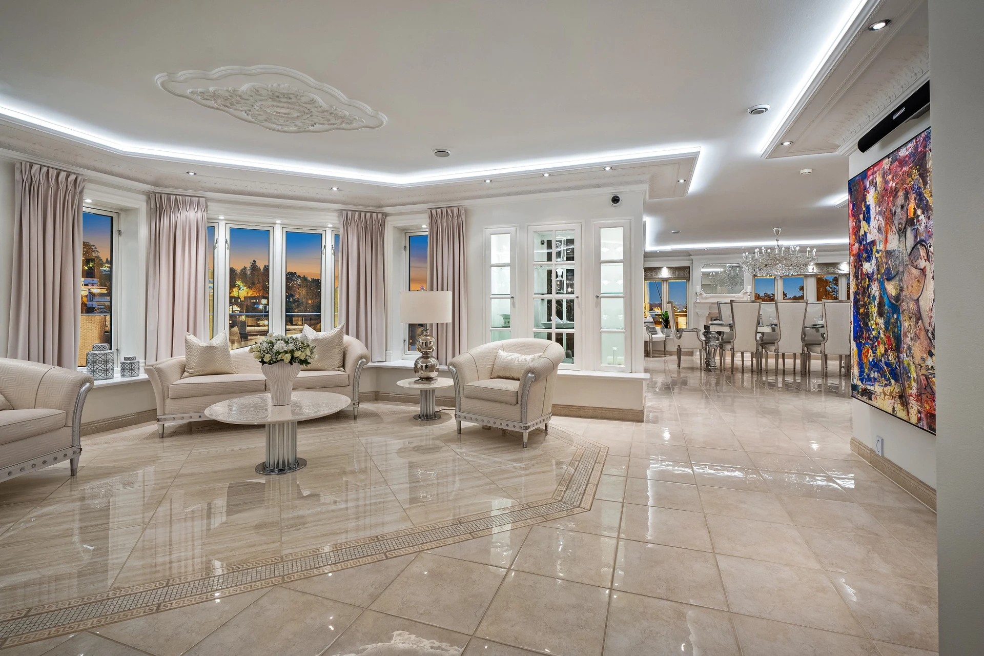 Grand living room with panoramic waterfront views and elegant furnishings