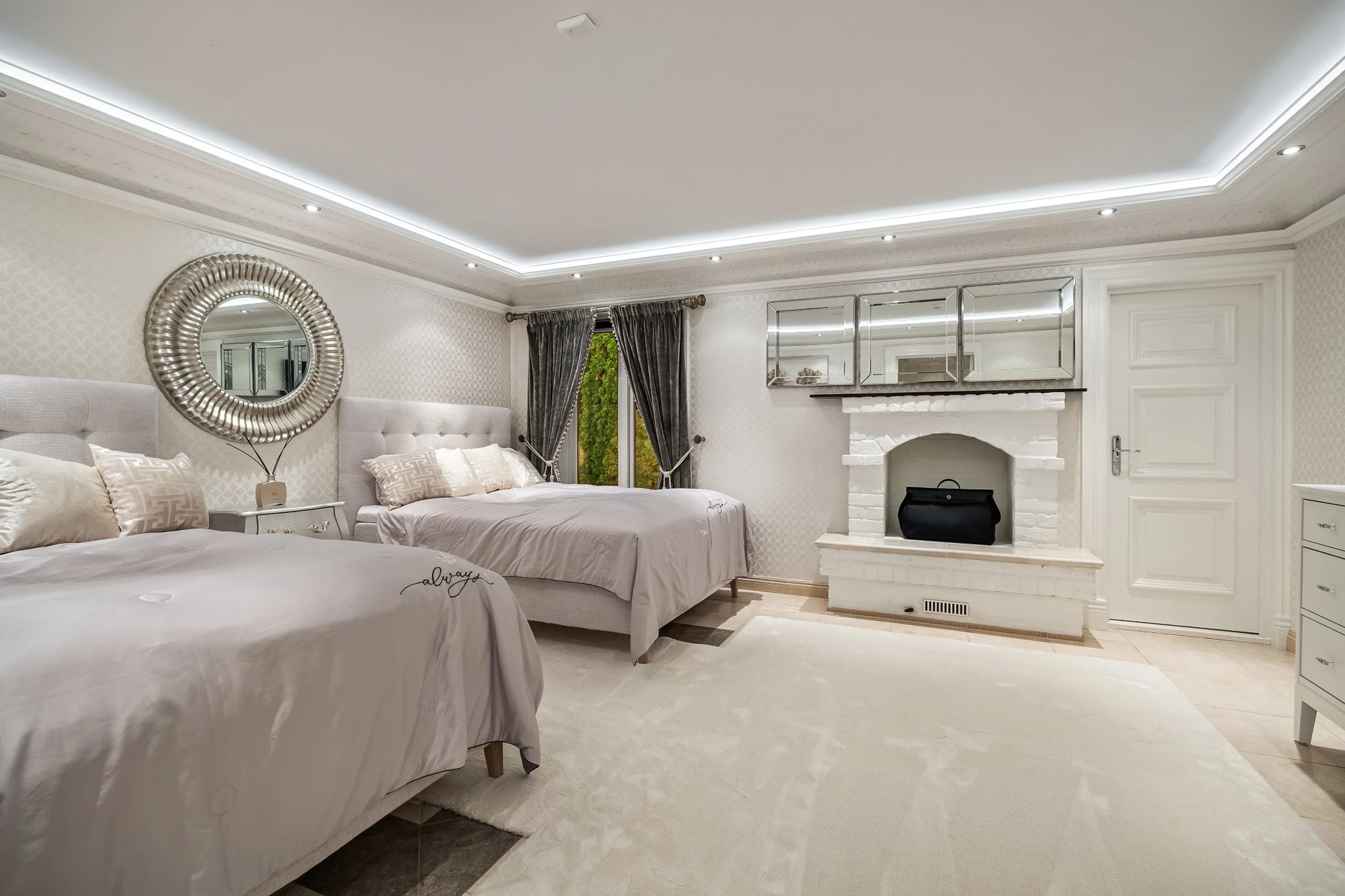 Guest bedroom with two beds and elegant styling