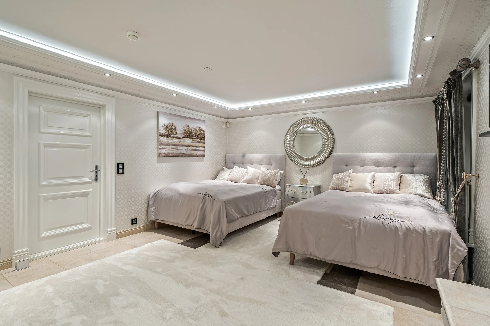 Guest bedroom with twin beds and textured wallpaper