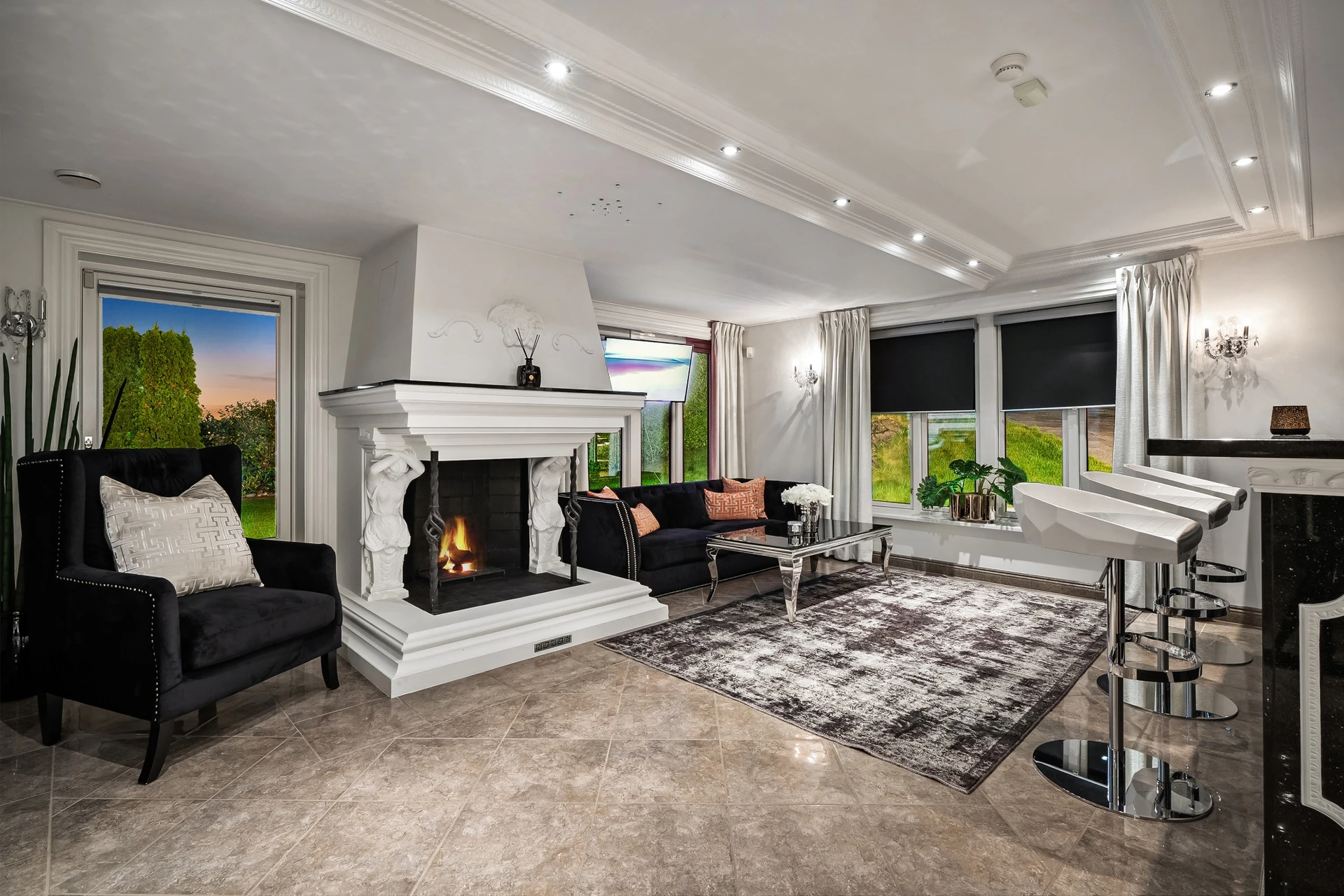 Entertainment room with white ornamental fireplace and grand piano