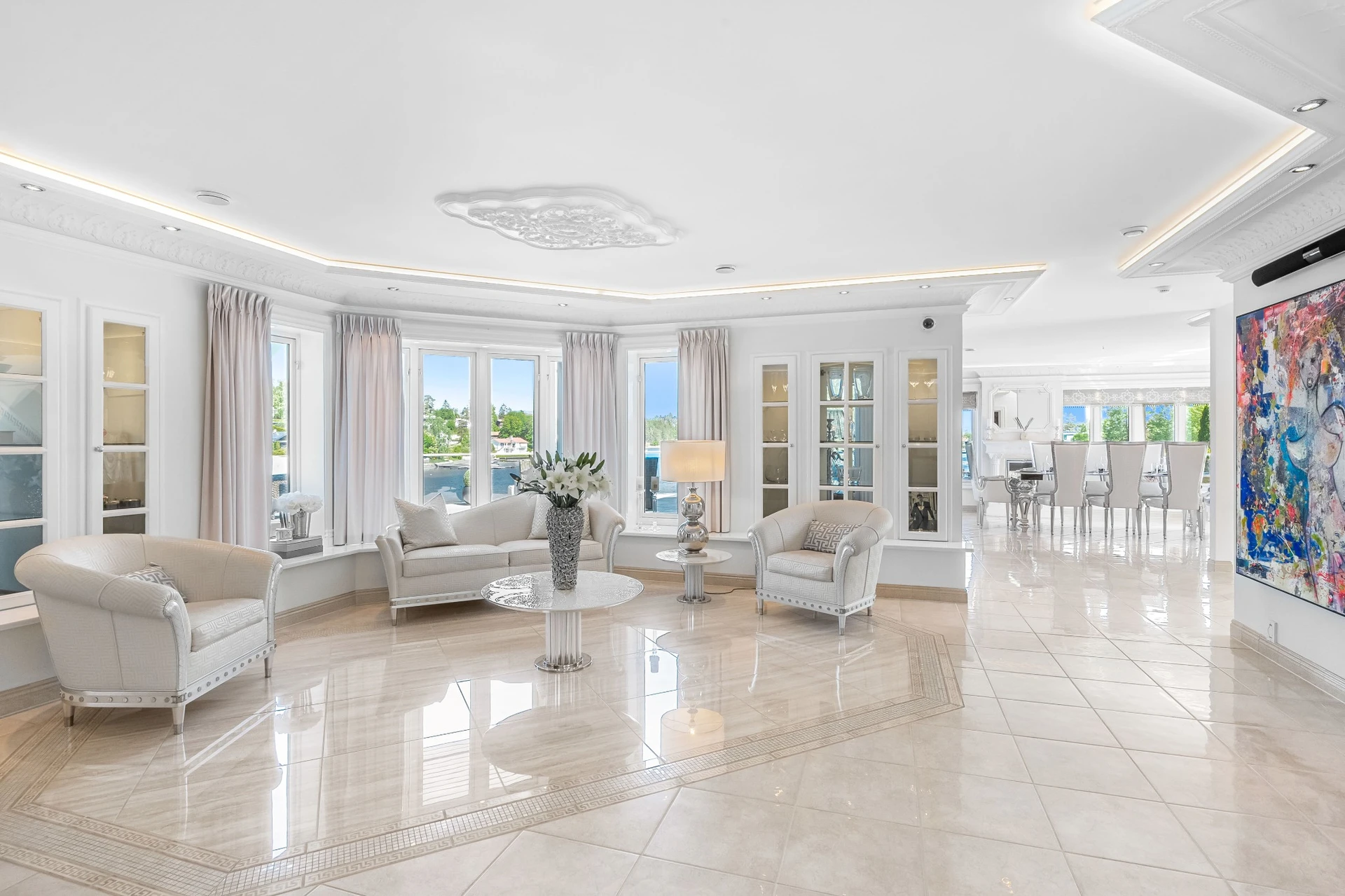 Elegant living room with daytime waterfront views