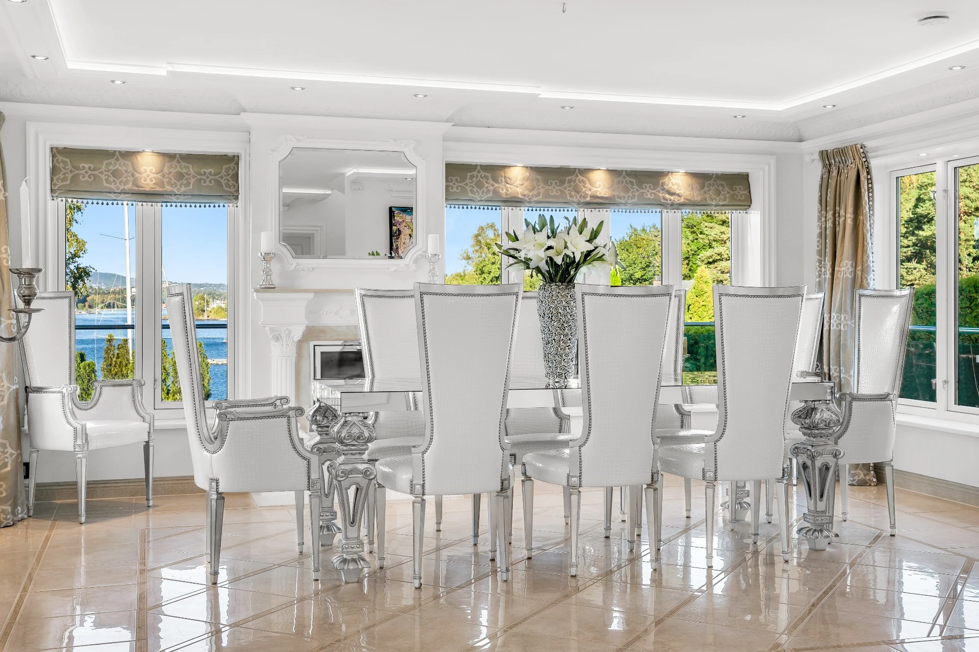 Dining room with silver chairs and panoramic views