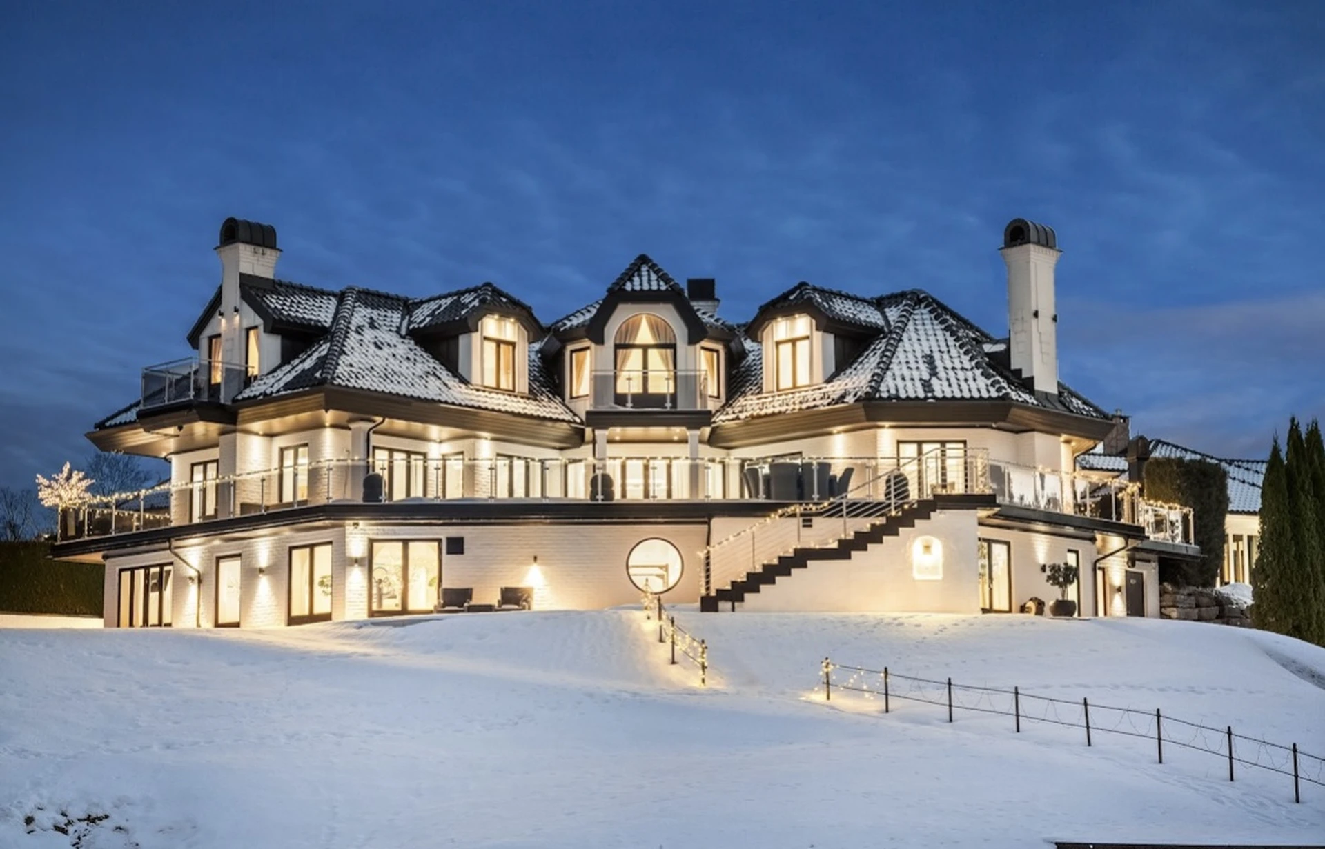 Luxury house in winter evening with dramatic lighting